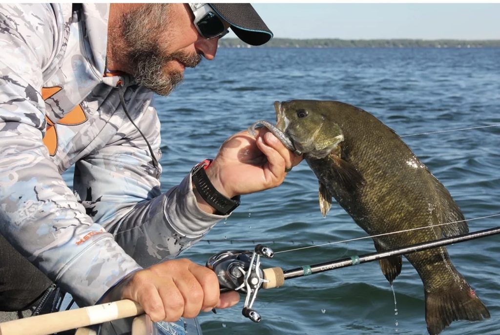 Jp DeRose with a smallmouth bass on lake Simcoe