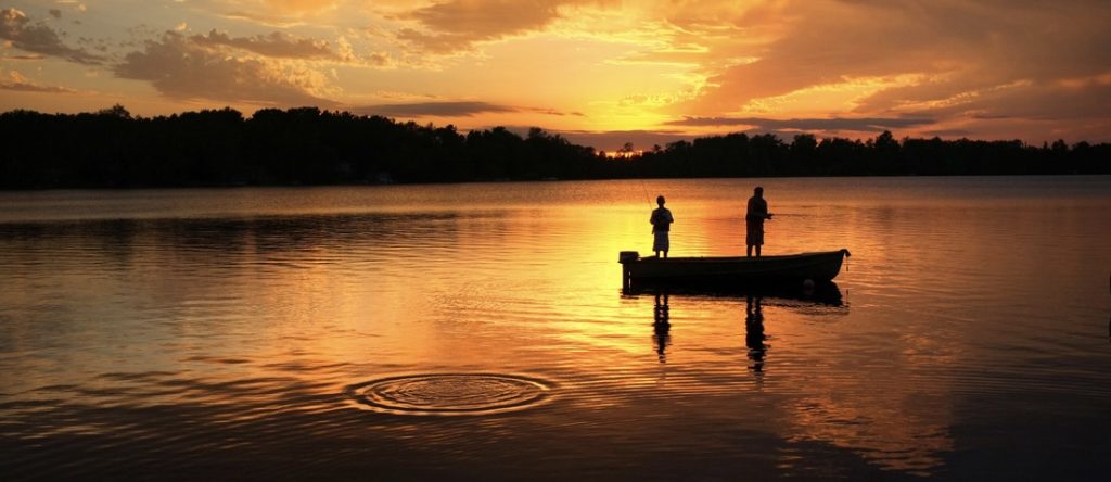 sunset on black lake while fishing for bass